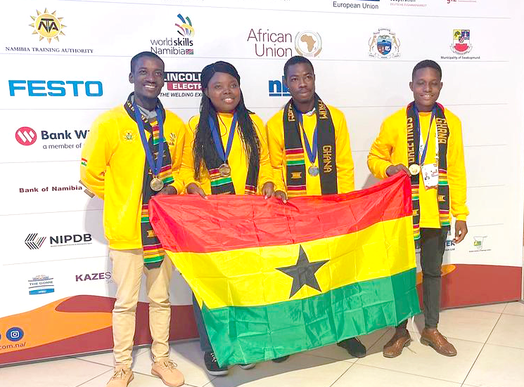 From left: Louis Morgan, Deladem Oko, Ibrahim Adam Kwaku and Manfuji Yao Agbo, the medallists, displaying the Ghana flag